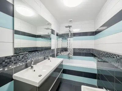 Obložení koupelny v novostavbě a instalace zařizovacích předmětů. 